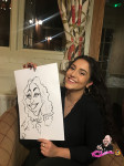 Tokio Marine HCC Christmas Party guests showing their Caricatures 16